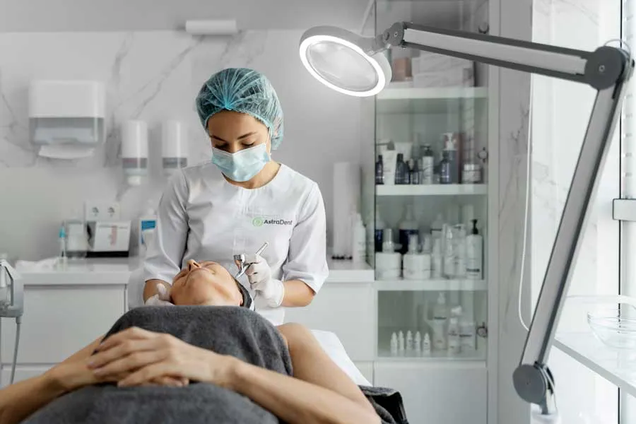 A patient receiving professional care in a modern aesthetic clinic