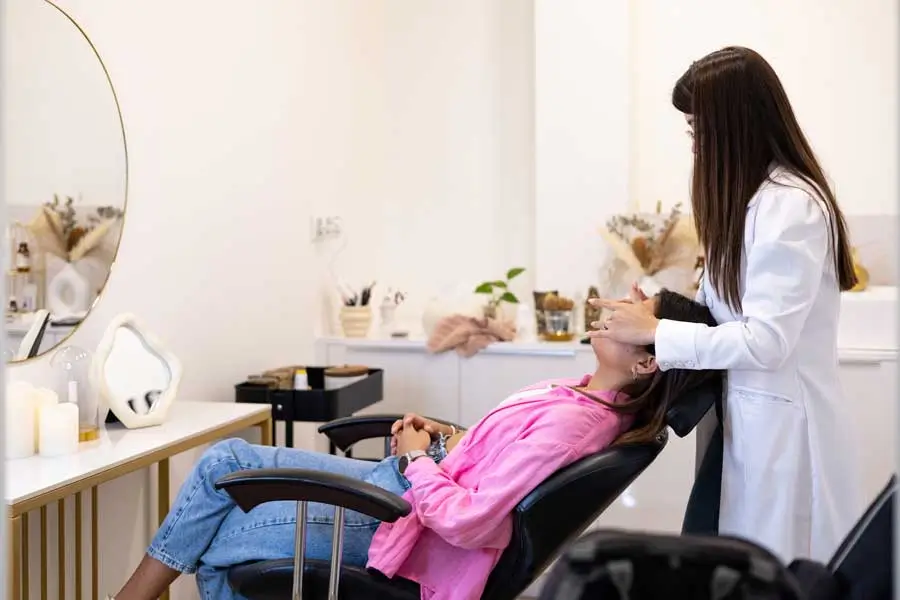 A patient receiving professional care in a modern aesthetic clinic