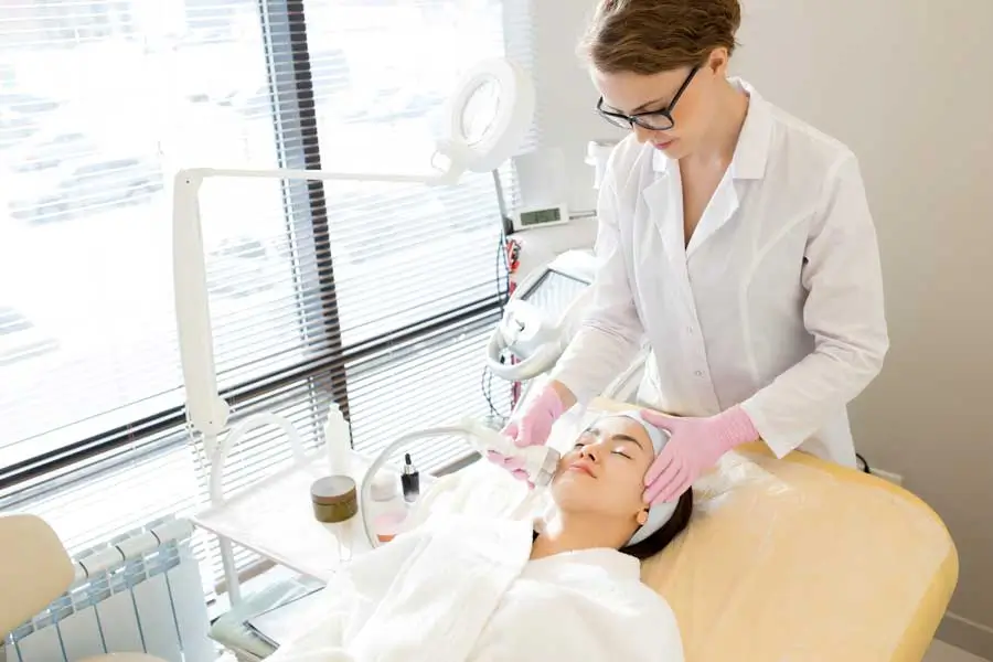 A patient receiving professional care in a modern aesthetic clinic
