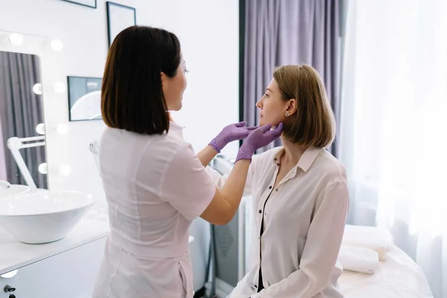 A patient receiving professional care in a modern aesthetic clinic