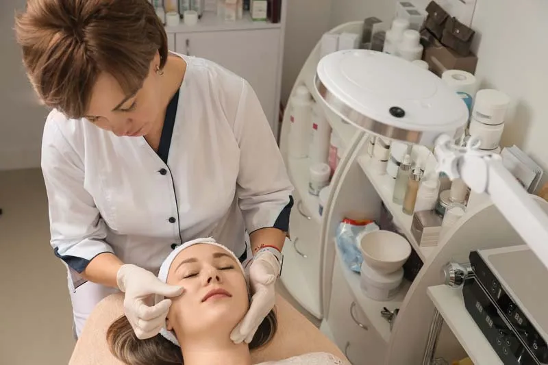 A patient receiving professional care in a modern aesthetic clinic