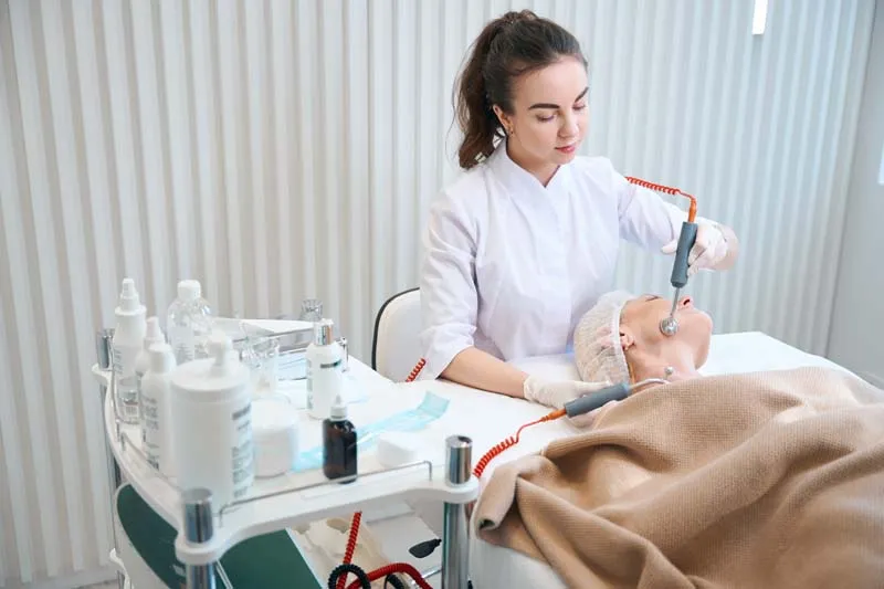 A patient receiving professional care in a modern aesthetic clinic